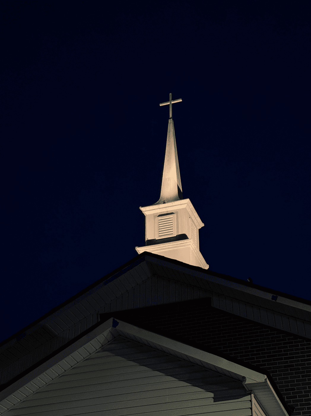 Church steeple with dramatic uplighting