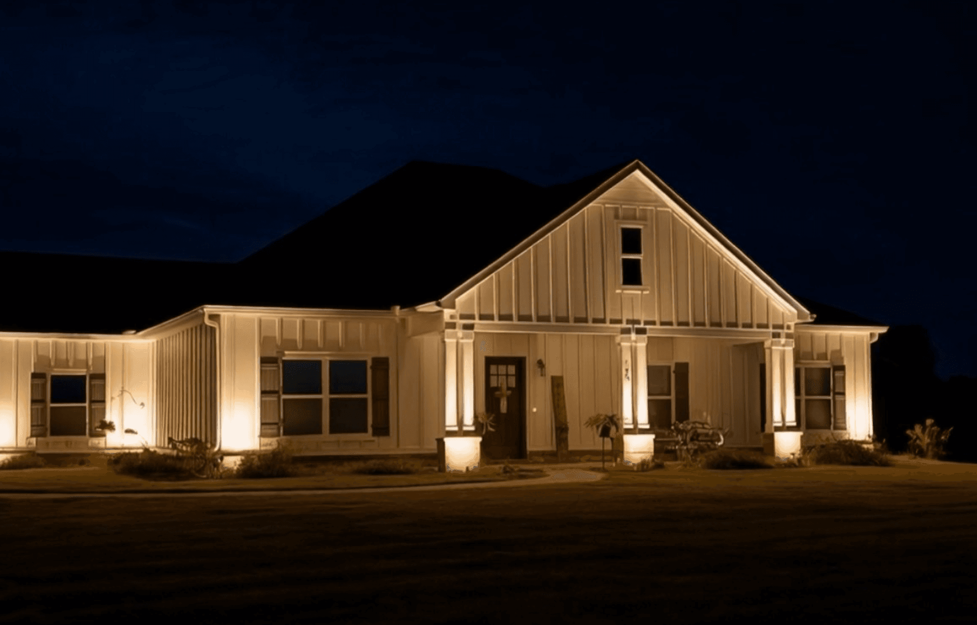 Modern farmhouse with elegant facade lighting